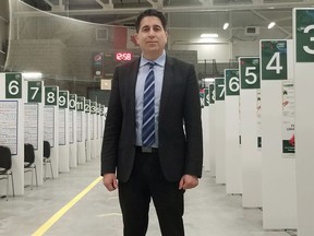 Grey Bruce Medical Officer of Health Dr. Ian Arra on the floor of the Hockey Hub immunization clinic at the P&H Centre in Hanover Friday, with numerous pods setup behind him.
KEITH DEMPSEY