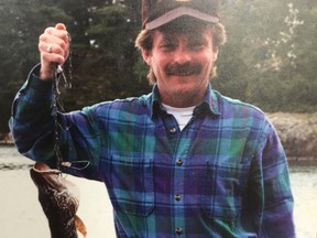 Todd Petrie celebrates a catch at a camp near West Branch, Mich. His mother is still waiting for Petrie's killer to be found a decade after his slaying. SUPPLIED