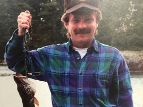 Todd Petrie celebrates a catch at a camp near West Branch, Mich. His mother is still waiting for Petrie's killer to be found a decade after his slaying. SUPPLIED