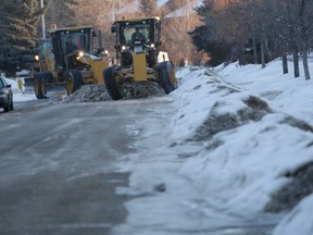 City graders and loaders work on clearing the windrows from side streets in Patterson. The city announced a snow route parking bans are in place beginning Wednesday. 
RANDY VANDERVEEN