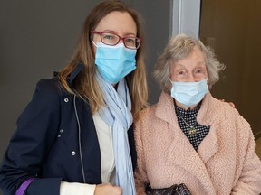 Marian Sunnen, who is 99 years old, received her first COVID-19 vaccine dose on Sunday morning at the John D. Bradley Convention Centre in Chatham. She's shown with her essential caregiver and great-niece Alysson Storey. (Trevor Terfloth/The Daily News)