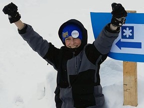 Tyler Ryan celebrates the end of his five-kilometre walk - 16 times around his family's circular driveway west of Brodhagen - for the Coldest Night of the Year fundraiser Feb. 20. SUBMITTED