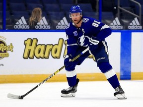 Steven Stamkos of the Tampa Bay Lightning looks to pass during a game against the Chicago Blackhawks on opening night of the 2020-21 NHL season  at Amalie Arena on Jan. 13, 2021, in Tampa, Florida. (Photo by Mike Ehrmann/Getty Images)