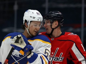 Brandon Montour, left, of the Buffalo Sabres and Jakub Vrana of the Washington Capitals talk at Capital One Arena on Jan. 24, 2021, in Washington, DC. (Photo by Rob Carr/Getty Images)