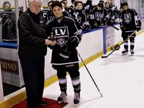 GOJHL deputy commissioner Mark Tuck presents LaSalle Vipers’ A.J. Ryan with his award as the top offensive player in the Western Conference for December 2018 during a pre-game ceremony at the Vollmer Complex in LaSalle, Ont., on Jan. 16, 2019. (Photo from GOJHL.ca)