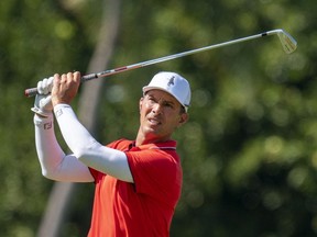 Mike Weir of Bright's Grove, Ont., hits his tee shot on the 11th hole during the first round of the Sony Open golf tournament at Waialae Country Club in Honolulu, Hawaii, on Jan. 14, 2021. (Kyle Terada-USA TODAY Sports)