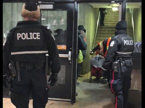 A video circulating social media shows Edmonton police telling a group receiving help from a local homeless service provider to leave the Central LRT station. (SCREENSHOT/FACEBOOK)
