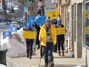 The Crisis Amigos team is led by Tim Kennedy as they take part in the Coldest Night of the Year walk to raise funds for Safe n Sound Grey Bruce in downtown Owen Sound on Saturday. The team was made up of YMCA Housing, Safe n Sound and transitional housing staff and some youth.