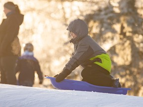 Liam Penner, 8 enjoys a morning sliding down the hill at Borstad Lookout in Muskoseepi Park this winter. The park will be a flurry of activity this weekend as it hosts Family Festivities in the Park.
RANDY VANDERVEEN