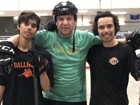 Sherwood Park Squires head coach Randy Rosen, proudly pictured with his sons Raoul and Isaac, will have the ice surface at the Sherwood Park Arena named in his honour. Photo Supplied