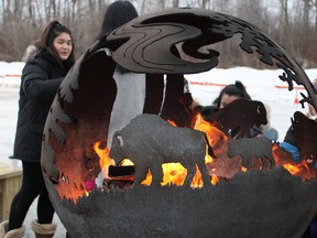 A fire pit keeps people warm at WinterPLAY 2020 on Sunday, March 1, 2020. Vincent McDermott/Fort McMurray Today/Postmedia Network