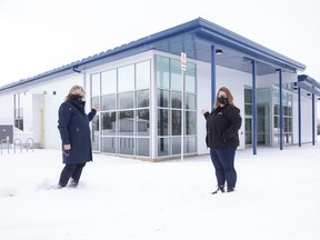 Thames Centre mayor Alison Warwick (left) and deputy mayor Kelly Elliot stand in front of the new Thorndale Community Centre in Thorndale on Friday January 29, 2021. February marks one year since a fire destroyed the old one, which was a community landmark. Derek Ruttan/The London Free Press