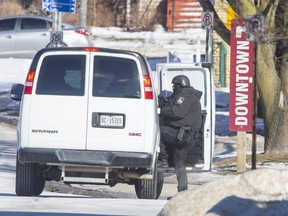 Woodstock police closed the area of Mill Street and Dundas Street for several hours during a weapons investigation on Thursday February 25, 2021. (Derek Ruttan/The London Free Press)