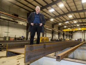 Dale Gaston of Algonquin Bridges stands on an I-beam destined for a 80-metre vehicular bridge in Cape Breton, N.S. The Thorndale company received a loan this week from FedDev Ontario, a federal agency supporting businesses in southern Ontario, that will allow it to buy machinery to make more parts on site. (Mike Hensen/The London Free Press)