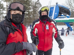 The first two skiers to go up the hill on the lift after the long-delayed opening at Boler Mountain in London were Stan Grohar, left, and Tony Loedige. Both men are 90 years old, and have been members since 1955 when Boler Mountain was a much smaller operation than it is today. (Mike Hensen/The London Free Press)