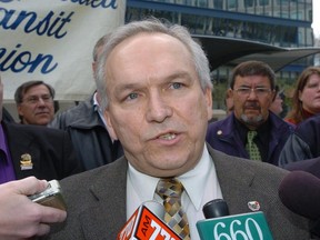 Mike Mahar, the local president of the Amalgamated Transit Union talks to media outside City Hall in Calgary. Nearly 1.8 million Albertans are on the list of those eligible to receive a COVID-19 vaccination in Phase 2 of the province's rollout, slated to begin in April. But some groups who have worked on the front lines throughout the pandemic are questioning why they've been left out of Alberta's plans entirely.