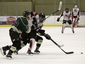 Minor Hockey across the province has been cancelled for the season. Here a member of the PAC Saints battles two Knights of Columbus Centennials during a Alberta Minor Midget Hockey League game in Stony Plain on March 2, 2020. The Saints won 3-0. Photo by Evan J. Pretzer Reporter/Examiner