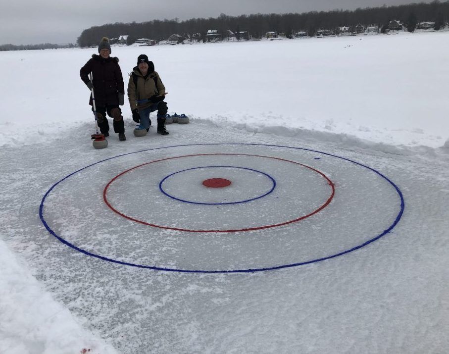 Couple 'having a blast' on curling sheet on Lake Eugenia Owen Sound