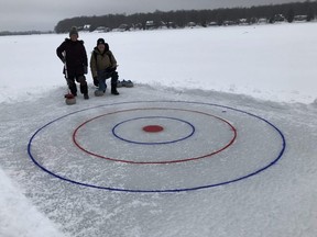 Lynne Simone and her husband Dave Furness have created a curling sheet behind their home on Lake Eugenia. SUPPLIED PHOTO