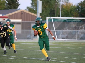 Tawal Kayumba runs the ball during the Fort Saskatchewan Sting's season opener against the Holy Trinity Trojans. The Fort Sting will be merging with Fort Minor Football for a shortened Spring Season.
Postmedia.