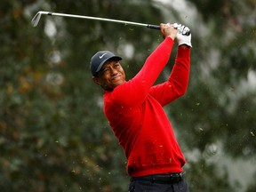 Tiger Woods hits a shot on the 4th hole during the final round of the Masters, November 15, 2020. PHOTO BY MIKE SEGAR /REUTERS