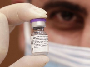 FILE: A medic prepares a dose of the COVID-19 Pfizer/BioNTech vaccine.