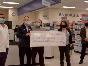 On Feb 10, Shopper's Drug Mart presented a cheque for a $12,000 donation to Airdrie POWER to help with the opening of the women's day shelter. Photo by Kelsey Yates