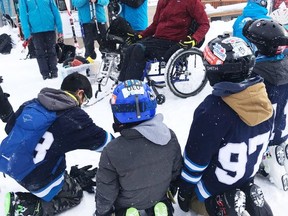 Canmore U-13 hockey team meet with Rocky Mountain Adaptive on Fed.19. at Sunshine Village. Athlete Dave shares his story with the group. The players had a fun relay race with the equipment. Readers are invited to vote online once everyday until Feb 24th. Photo credit Cora Lee Kjemhus.