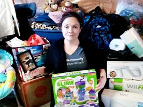 Chesley resident Alicia Sylvest, who launched Kenny's Kidz in 2018, sits in front of some of the donations she's collected for people in need in the community. SUPPLIED
