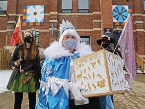 Ice Box co-founder Krista Dalby of the Department of Illumination art group holds a box of art activities for children Saturday behind the armoury in Picton. With her were Heather McCorquodale, an intern with the Department, and Ryan Henderson, president of the board.