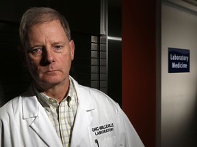 Dr. Dick Zoutman, then chief of staff of Quinte Health Care, stands outside the medical microbiology laboratory at Belleville General Hospital Thursday, Jan. 28, 2016. He's now among the medical experts saying efforts to control COVID-19 must be strengthened, not relaxed, if longer-term harm is to be avoided.