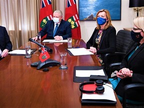 Premier Doug Ford, centre, and senior provincial members met in a virtual meeting with Ontario's 440 mayors Friday. Ford said municipalities are key to delivering vaccines given they are ground zero in the fight against COVID-19. OFFICE OF THE PREMIER