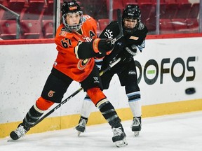 Burford's Emma Woods (67) moves the puck for the Toronto Six during a recent National Women's Hockey League game at Herb Brooks Arena in Lake Placid, New York.