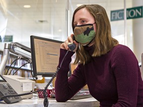 Madison Robertson, an information assistant at the Brantford Public Library chats with a senior over the phone on Thursday. Staff are placing calls to about 900 seniors to see how they are doing during the pandemic, and offer assistance with the library's online services.