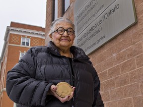 Jan Longboat of Six Nations holds the Guthrie Award presented to her and 11 other members of the Elders' Council by the Law Foundation of Ontario.