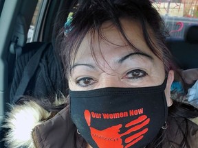 Valarie King, of Mississaugas of Credit First Nation, wears a mask to remember missing and murdered Indigenous women and girls.
