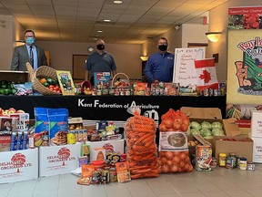 The Kent Federation of Agriculture recognized Canada's Agriculture Day on Tuesday by collecting food items for local foods banks. Shown here are Brenda LeClair, executive director of Outreach for Hunger, Chatham-Kent Mayor Darrin Canniff, Capt. Stephen Holland from Salvation Army, Jay Cunningham, KFA president and Mary Anne Udvari, KFA agriculture day co-ordinator. PHOTO BY HANDOUT