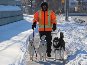 Cornwall resident Kevin Empey, out for a walk with his Siberian Huskies (from left) Zoey, Nukka and Sasha. Photo on Sunday, January 31, 2021,  in Cornwall, Ont. Todd Hambleton/Cornwall Standard-Freeholder/Postmedia Network