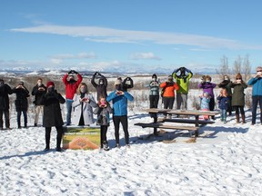 Volunteers from the Glenbow Ranch Park Foundation gather February 19 in the area they steward to celebrate the launch of a new park sponsorship program.