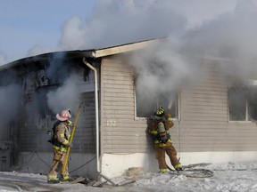 Fort McMurray firefighters battle a house fire in Gregoire on Monday, Feb. 8, 2021. Sarah Williscraft/Fort McMurray Today/Postmedia Network