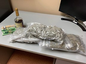Open alcohol, cash and cannabis were found in a vehicle on Highway 401 by Lennox and Addington County Ontario Provincial Police.