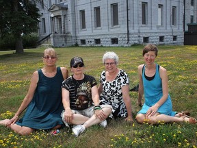 Advocates for a memorial garden for the closed Prison for Women include former inmates Ann Hansen and Fran Chaisson, at left, with supporters Jackie Davis and Lisa Guenther, at right, in front of the former prison in July 2018. It was announced last week that there could be a seniors residence built on the site.