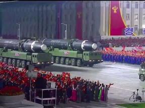 A screen grab taken from a KCNA broadcast in Octoger 2020 shows North Korean Hwasong-12 intercontinental ballistic missiles during a military parade marking the 75th anniversary of the founding of the Workers' Party of Korea, on Kim Il Sung square in Pyongyang.