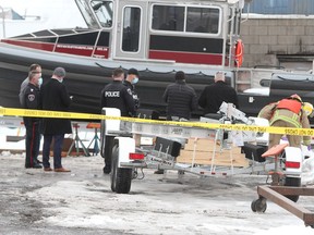 Kingston Police and Kingston Fire and Rescue gather at Kingston Marina on Wednesday after a body was recovered from the Inner Harbour.