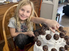 Eight-year-old Izzy Loohuizen of Exeter decided a few weeks ago to start making and selling cake pops to raise money for the Coldest Night of the Year fundraiser this month. As of Feb. 8 she had raised nearly $400, and she intends to continue supporting different charities each month. Handout
