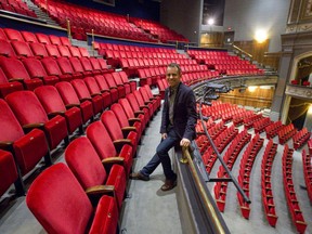 Artistic director Dennis Garnhum sits among empty seats in the balcony of London's Grand Theatre, which has cancelled the balance of its season in the face of the COVID-19 pandemic. (Files)