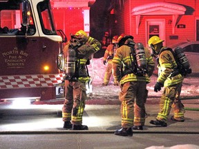 Firefighters prepare to enter a building on McIntyre Street East Saturday morning. The investigation into the fatal fire is now in the hands of the coroner.
Nugget File Photo