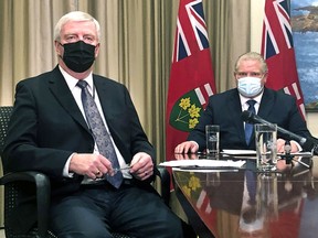 Ontario Premier Doug Ford and retired Gen. Rick Hillier, chair of the COVID-19 vaccine distribution task force, inform Ontarians that Health Canada has approved the AstraZeneca COVID vaccine before speaking with all of Ontario's 444 mayors on a conference call at Queens Park, Friday. 
Jack Boland Postmedia