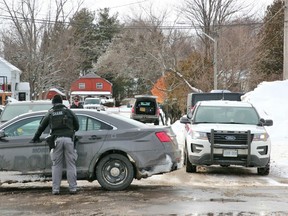 Police are seen at a home on Passmore Avenue, Saturday afternoon, to search for possible explosives. One male has since been taken into custody. Michael Lee/The Nugget