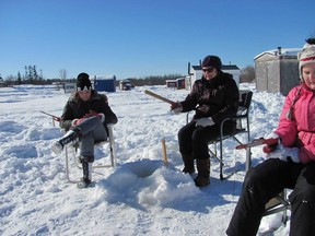 The author's wife and daughters enjoy some winter fishing on the Ottawa River during the 2017 winter season.